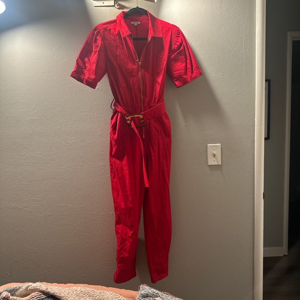 WE WORE WHAT RED JUMPSUIT